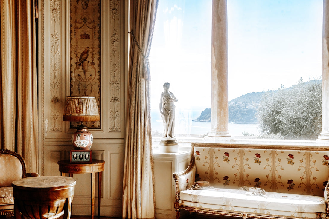 a living room filled with furniture and a statue