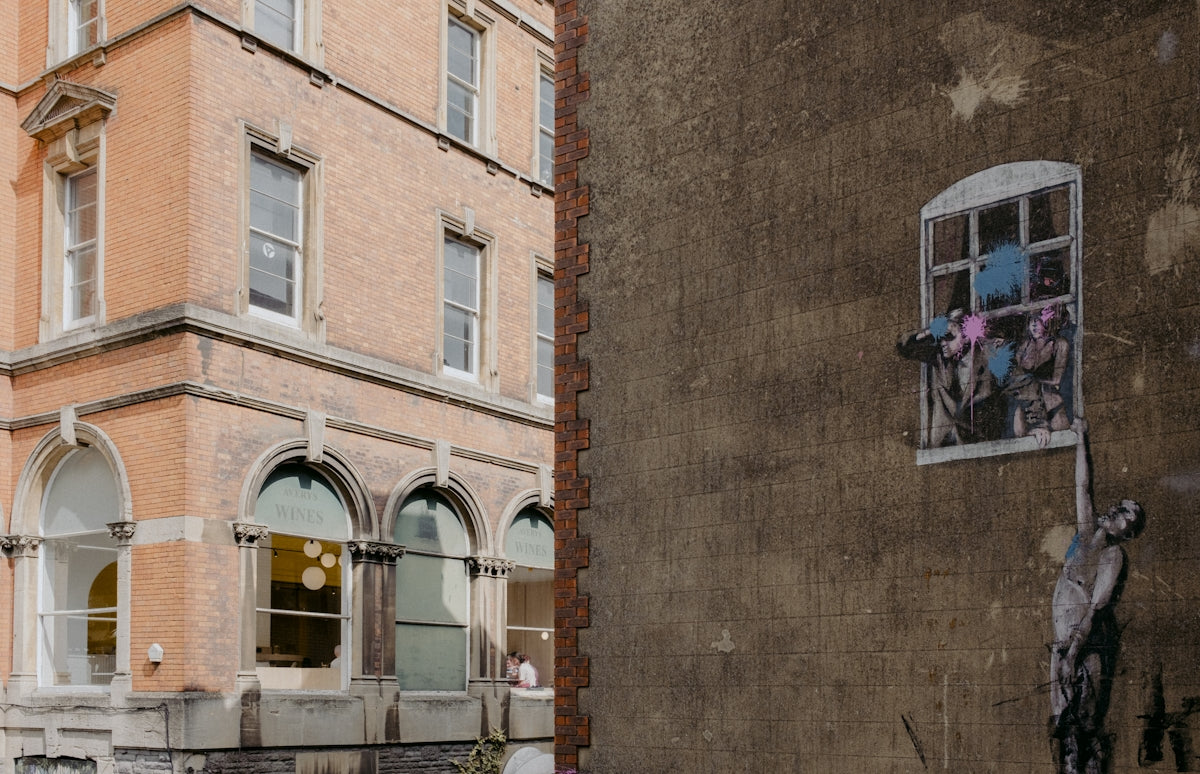 A tall building with a window on the side of it