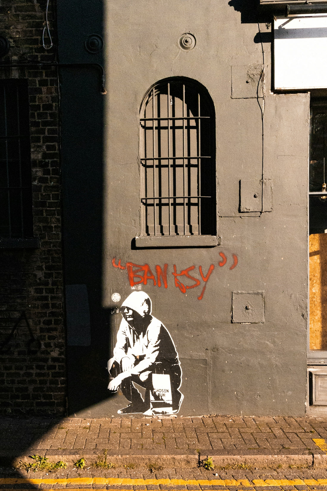 Banksy artwork features on an exterior wall.