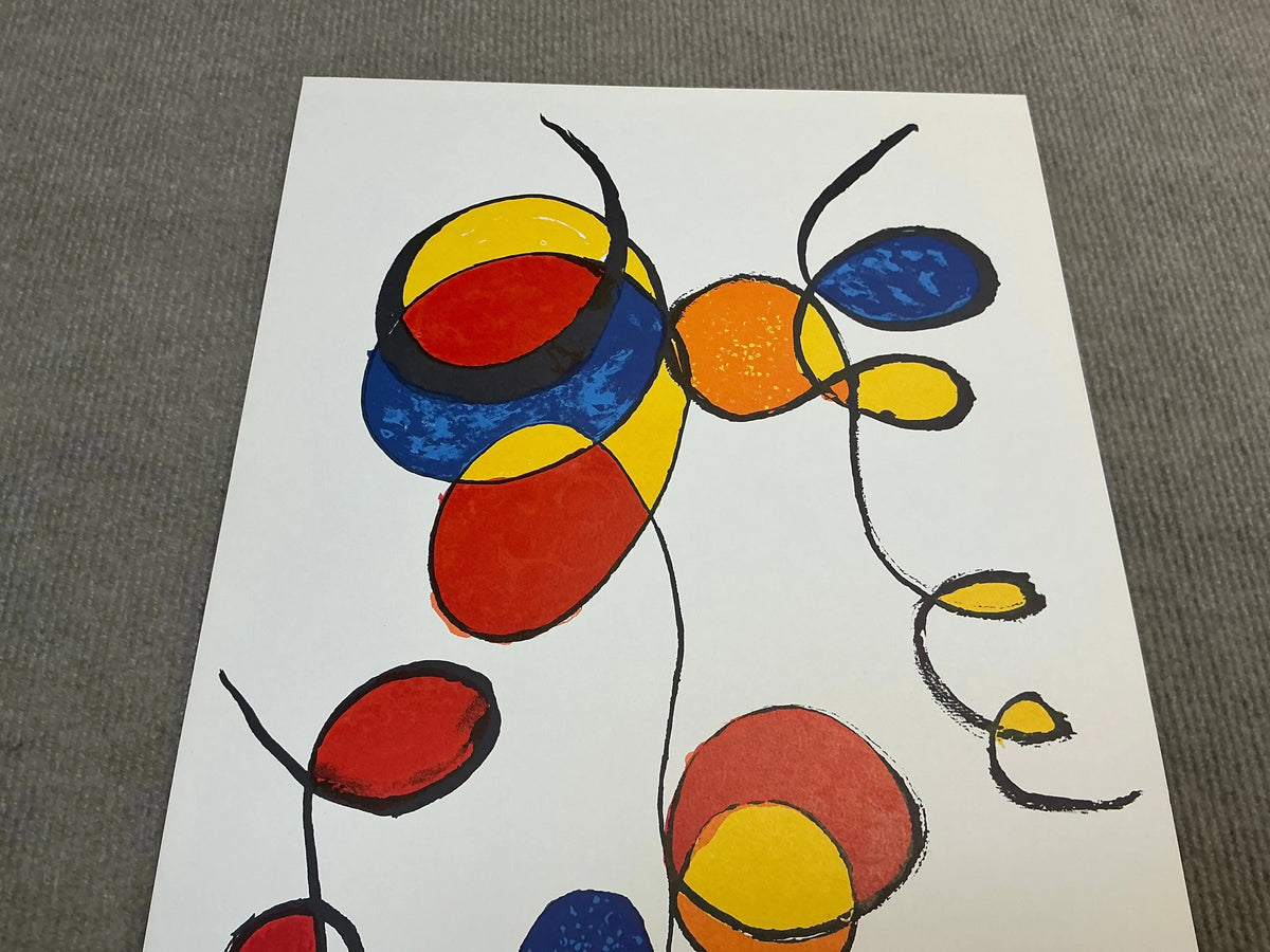 Original abstract lithograph print by Alexander Calder featuring swirling spirals, created in 1974.