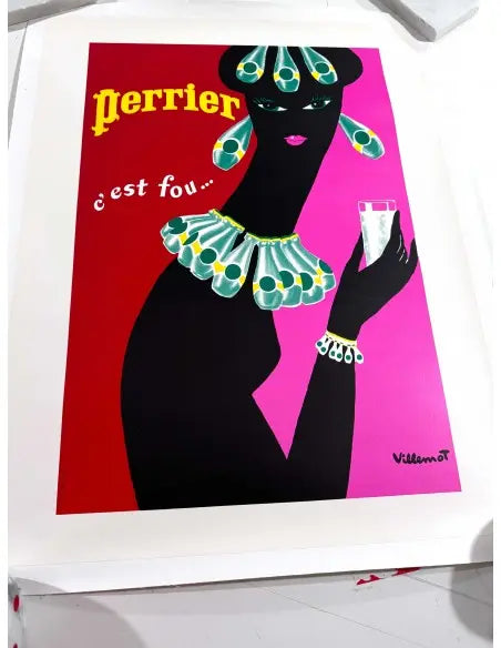 Vintage Perrier Femme Noir 1977 poster by Bernard Villemot featuring bold black and white design with elegant Perrier bottle illustration.