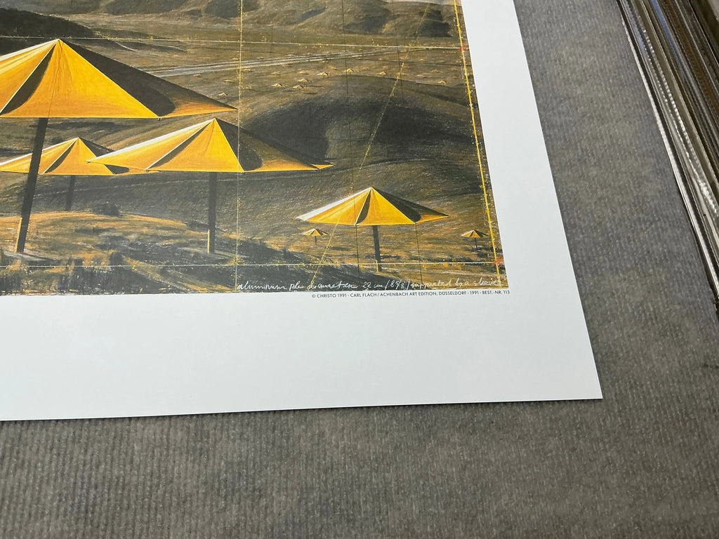 Offset lithograph poster of Christo & Jeanne-Claude's Yellow Umbrellas from 1991 exhibition showing vibrant yellow umbrella imagery.