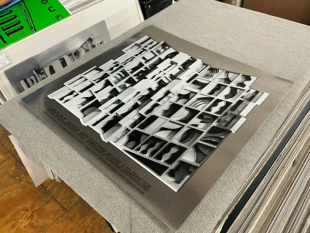 Louise Nevelson Lunar Silence silver foil art print from 1977, showcasing abstract exhibition artwork with textured silver details.