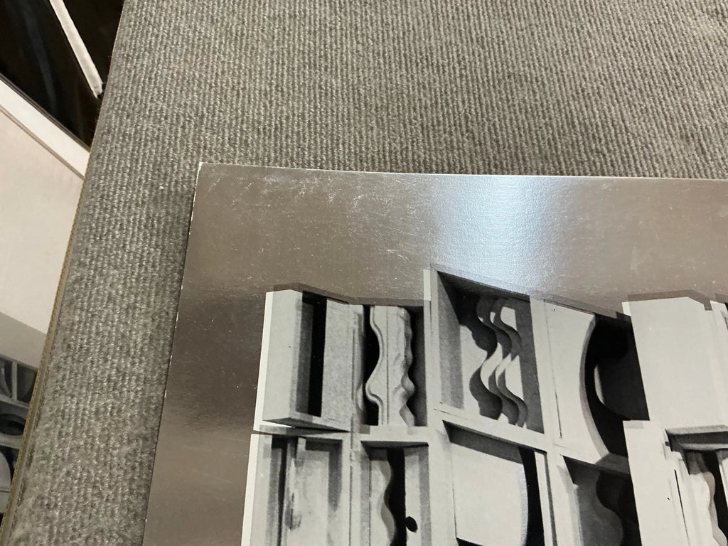 Louise Nevelson Lunar Silence silver foil art print from 1977, showcasing abstract geometric shapes and textured surface.