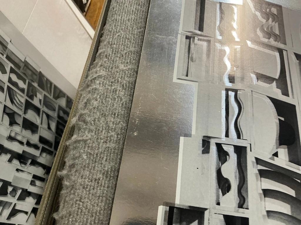 Louise Nevelson Lunar Silence silver foil art print from 1977, showcasing abstract geometric shapes and metallic finish.
