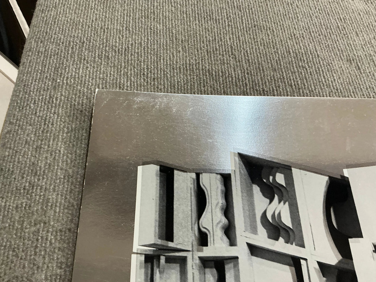 Louise Nevelson Lunar Silence silver foil art print from 1977, showcasing abstract geometric shapes and textured surfaces.
