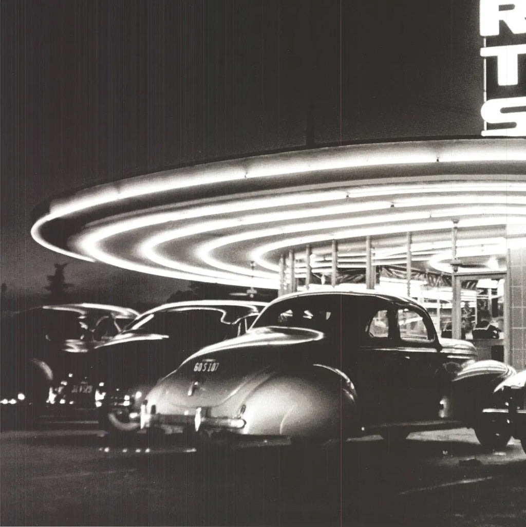Nina Leen neon drive-in diner photography art poster print showcasing vintage diner scene with neon lights and retro atmosphere.