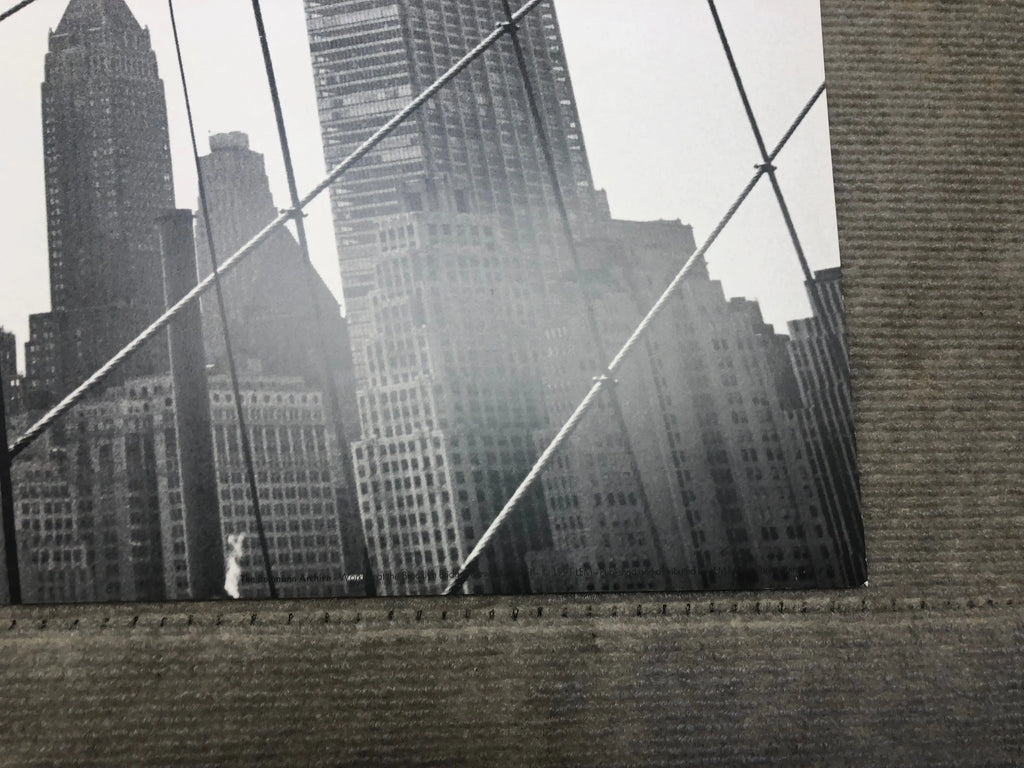 Otto Bettmann lithograph poster of workers on the Brooklyn Bridge, 1991, showcasing detailed vintage artwork and historical scene.