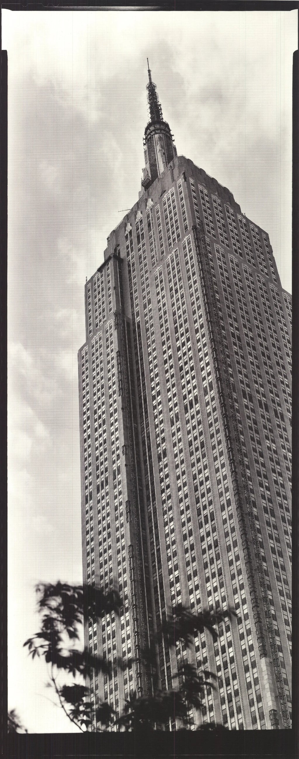 Black and white architecture poster of the Empire State Building by Paula Barr, showcasing detailed cityscape in 1998 style.