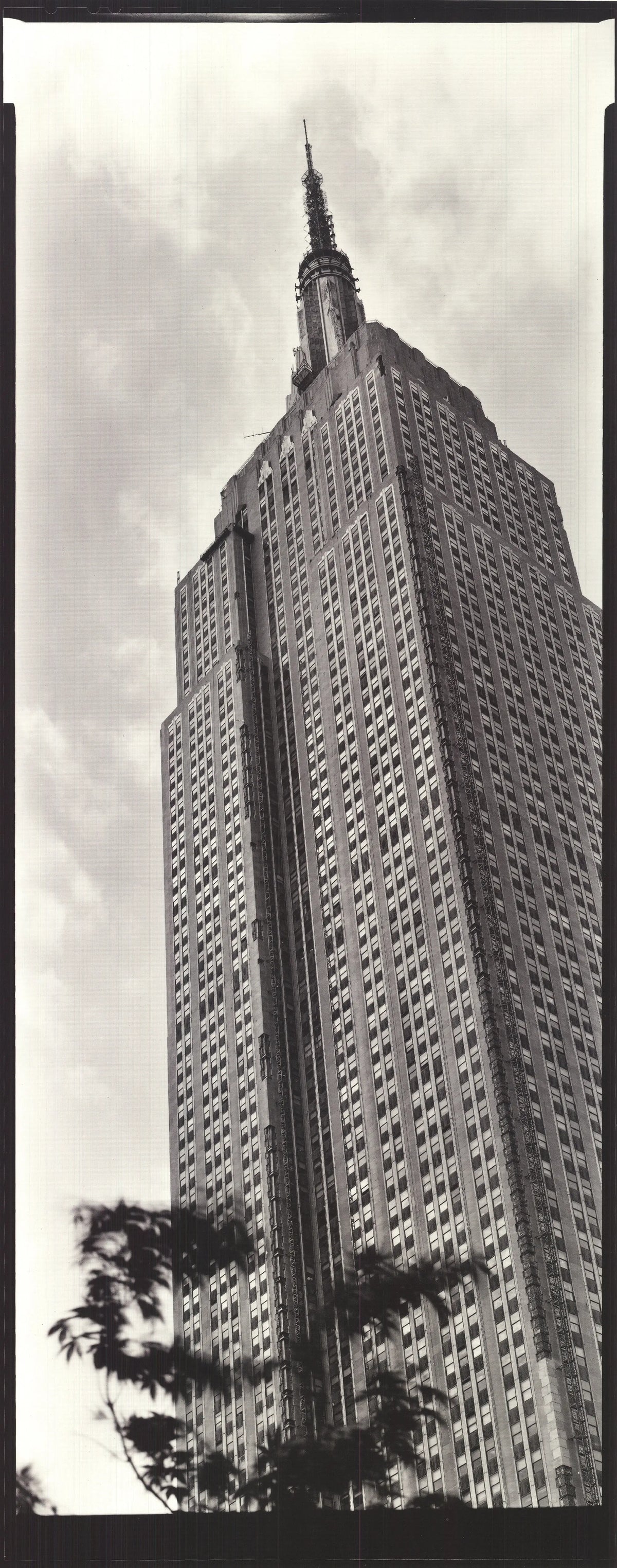 Black and white architecture poster of the Empire State Building by Paula Barr, showcasing detailed cityscape in 1998 style.