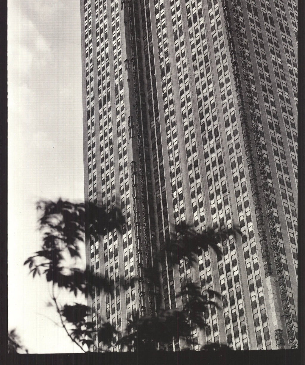 Black and white architecture poster of the Empire State Building by Paula Barr, 1998, showcasing detailed cityscape imagery.