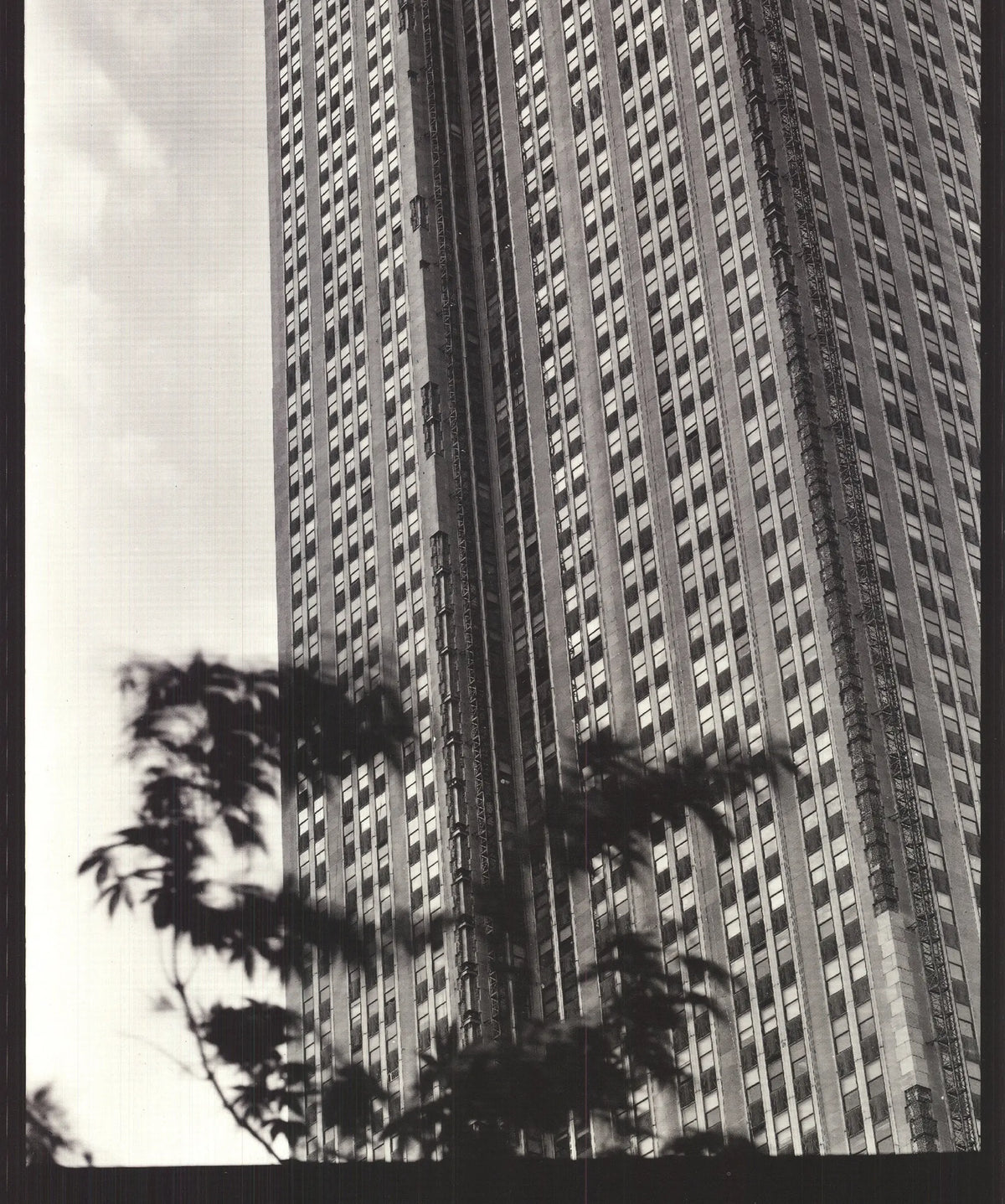 Black and white architecture poster of the Empire State Building by Paula Barr, 1998, showcasing detailed cityscape imagery.