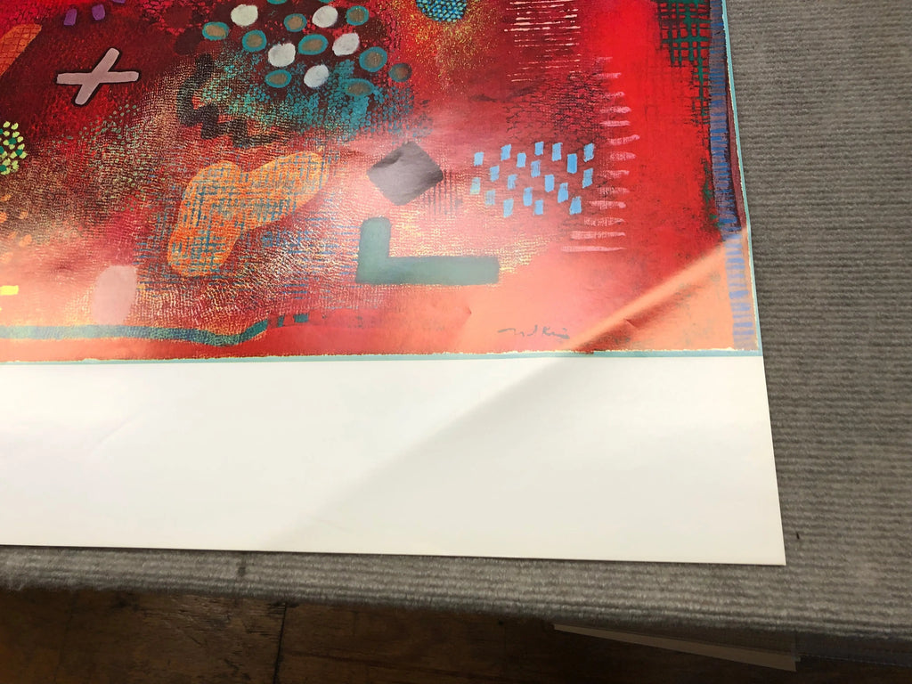 Colorful abstract lithograph poster by Robert Natkin featuring vibrant shapes and bold design in an exhibition display.