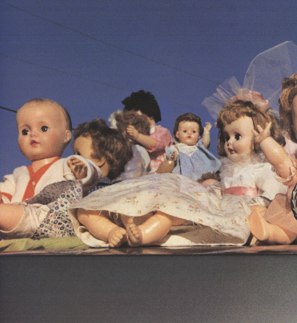 William Eggleston Dolls on a Cadillac 2004 large offset lithograph poster showing colorful dolls on a vintage Cadillac.