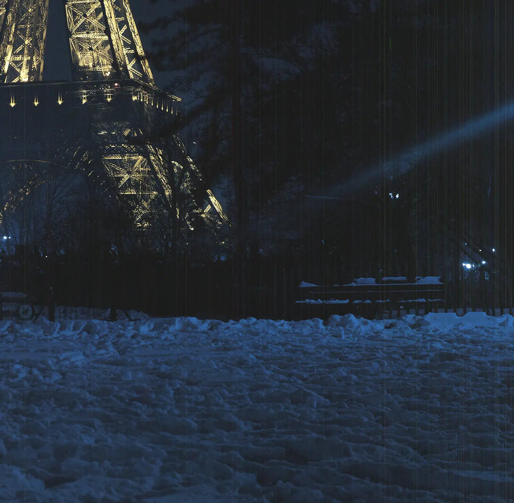 Winnie Denker L'Hiver La Tour Eiffel 1987 Paris offset lithograph poster showing Eiffel Tower in winter scene